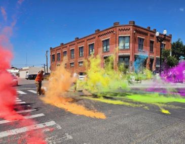 Picture of people decorating the streets in front of an art gallery