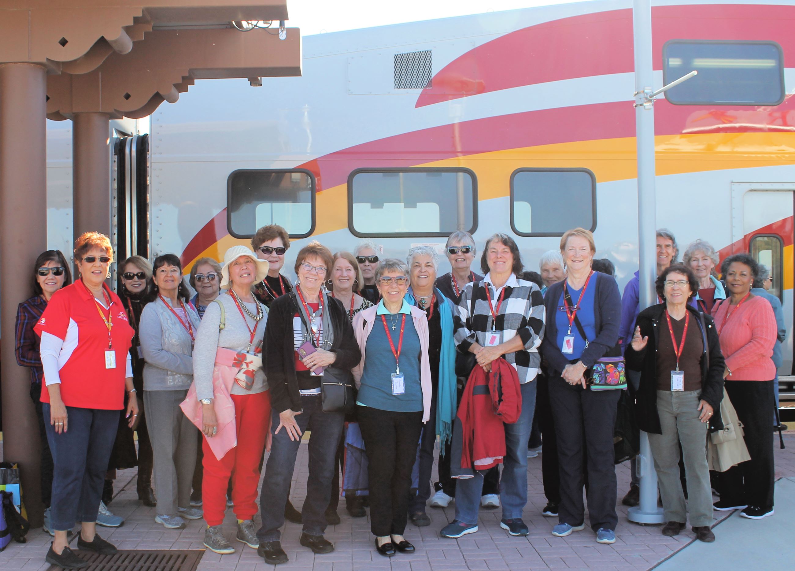 Group of Seniors Standing in Front of the Rail Runner Commuter Train
