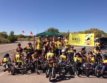 Group of individuals with adaptive bicycles