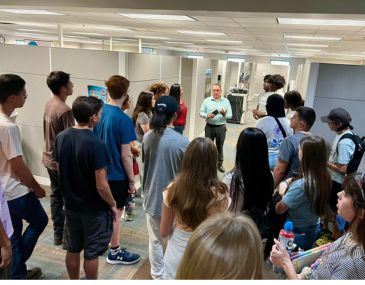 Picture of high school students inside an ABQ RIDE bus facility