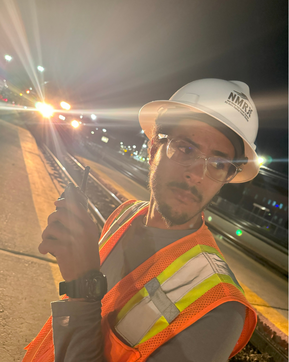 Rio Metro employee Eric Murphy standing near the railroad tracks at the Downtown Albuquerque station