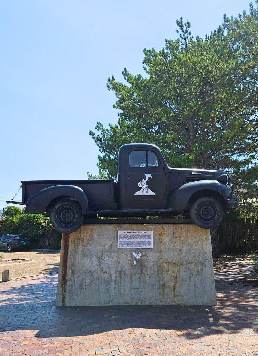 Picture of a public art piece featuring a truck on a pedestal