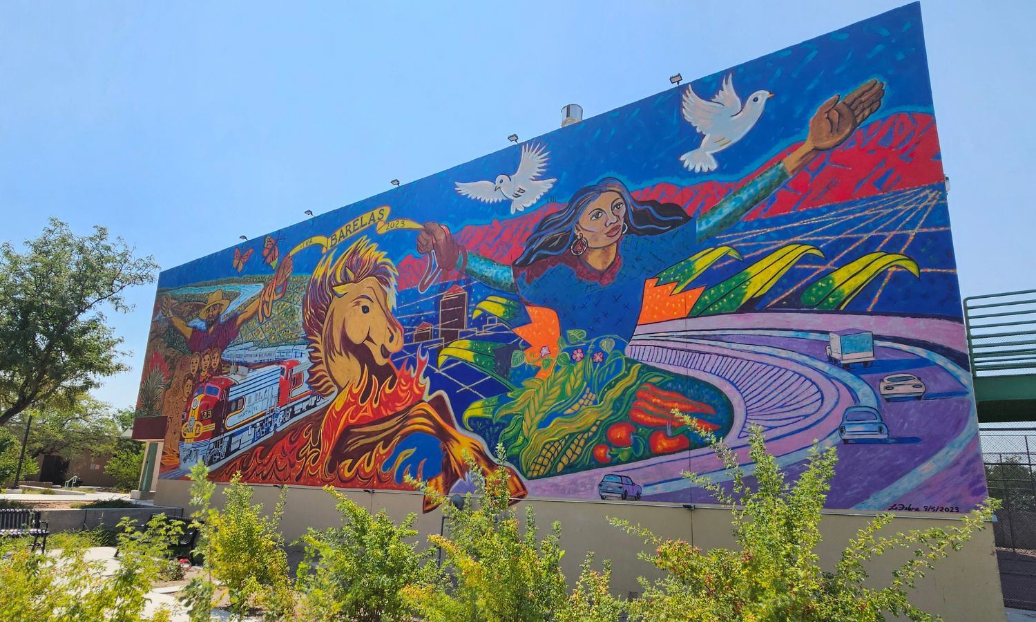 Picture of a colorful mural painting on the side of a building