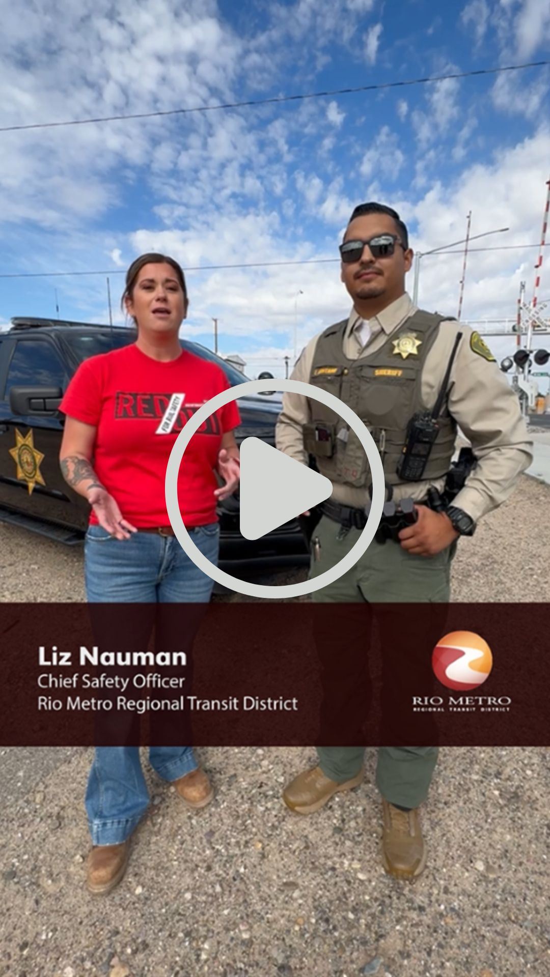 Picture of the Rio Metro safety officer and a Valencia County Sheriff Deputy near a railroad crossin