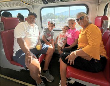 Kids and Grandparents Riding the Rail Runner Train Together